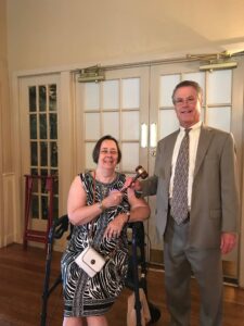 Tracey Melia passes the gavel to Michael Louis, the new president of the West Chester Lions Club.